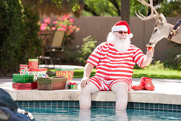 Real Santa and reindeer Relaxing by the Pool _ ool gifts for everybody