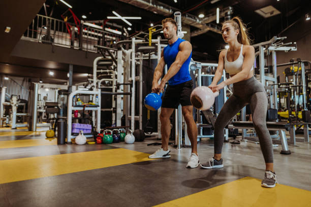 Couple exercising in the gym - fitness gifts for couples