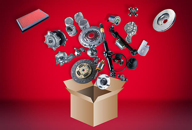 Many spare parts flying out of the box on grey background - gifts for your mechanic boyfriend