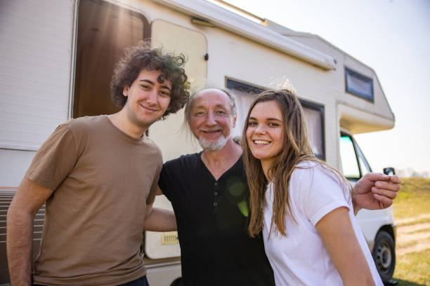 Portrait of father with daughter and daughter's boyfriend , during their camper adventure - Gift Ideas for Daughter’s Boyfriend