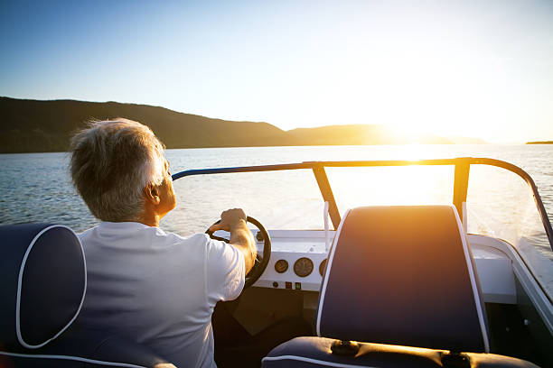 mature man driving speedboat - boating Father's Day gifts