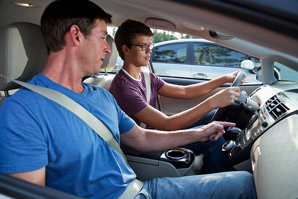 Teenager (15 years) with driving instructor (40s). - gift ideas for a new teen boy driver